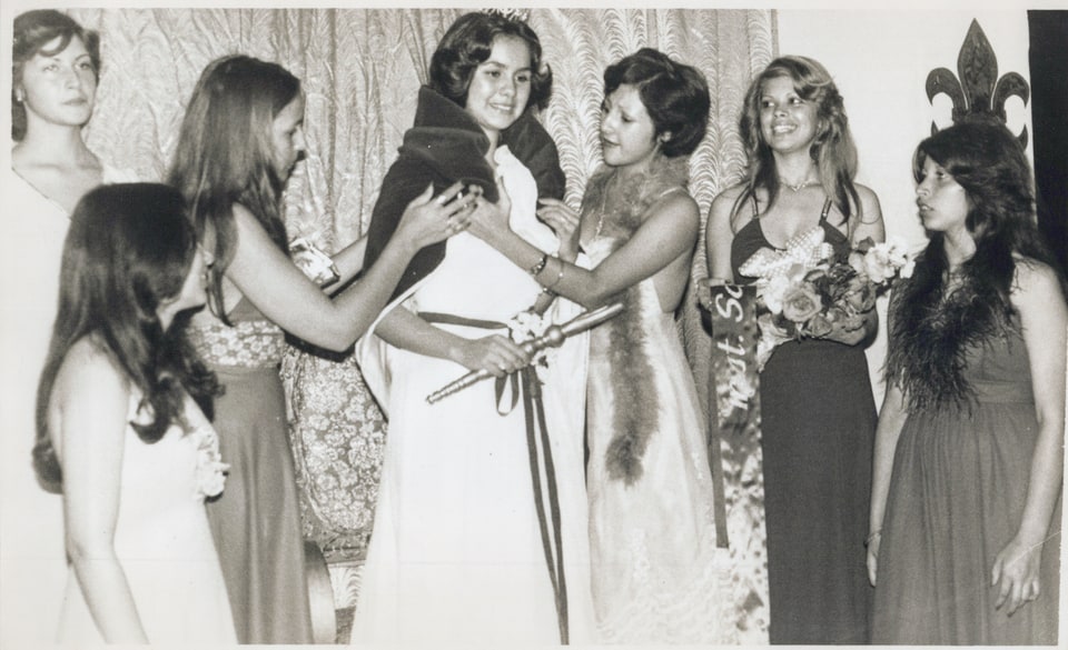 Black-and-white group photograph of Xiomara and several women at a formal event.